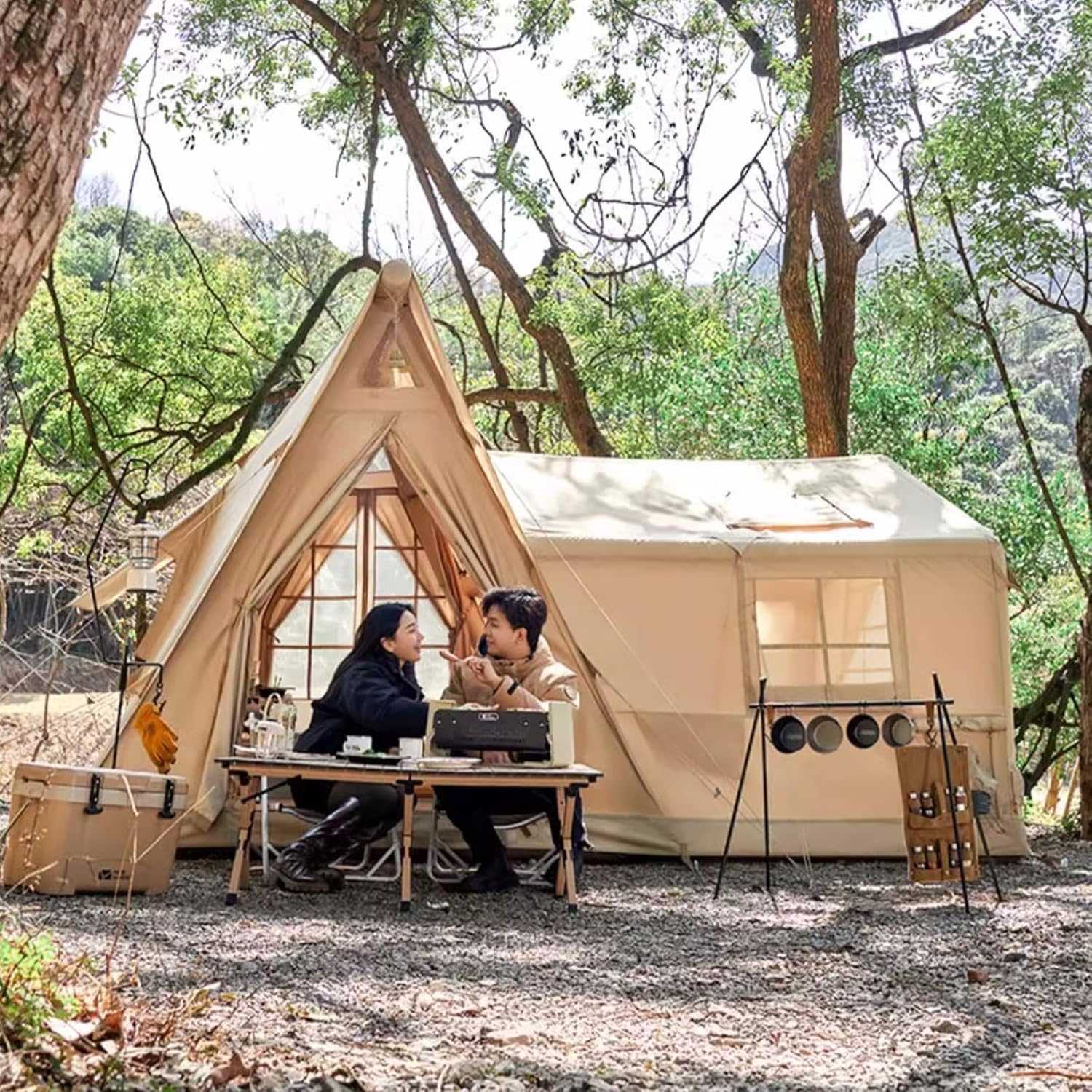 Large Blow Up Tent pitched in the forest that inflates in under 5 minutes